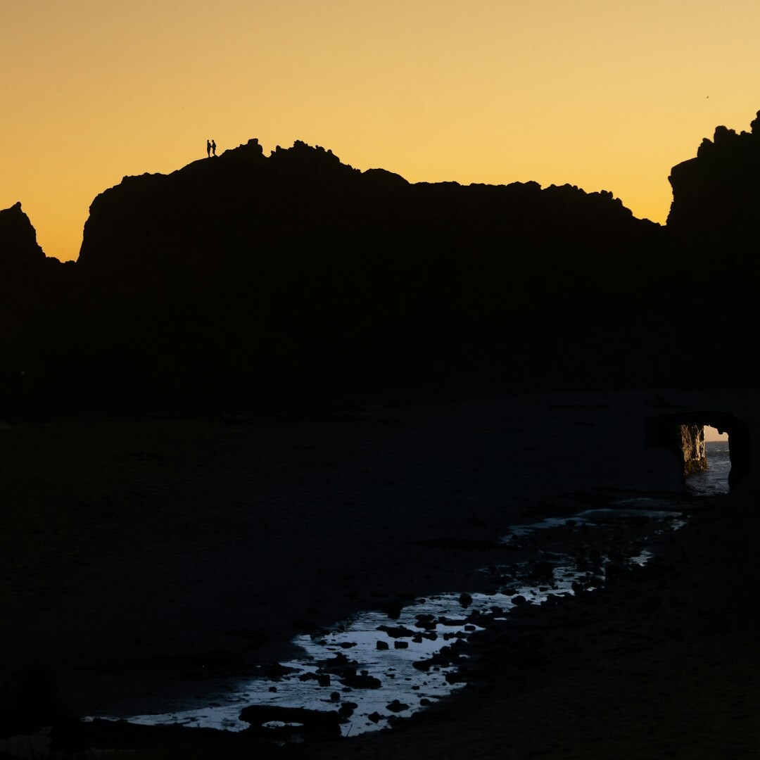 Fisherman preparing nets at dawn on the coast