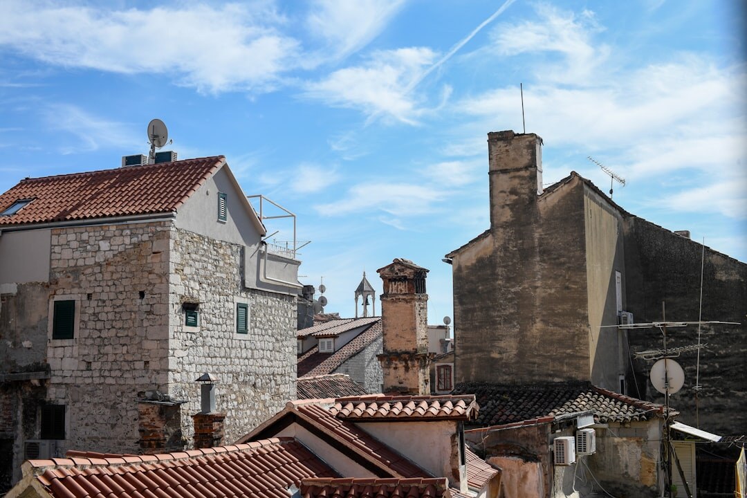 Traveler exploring a Croatian old town with a map